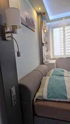Ein Bett oder Betten in einem Zimmer der Unterkunft Elegance Suiten Wien