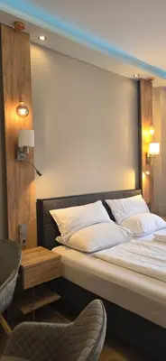 Ein Bett oder Betten in einem Zimmer der Unterkunft Elegance Suiten Wien