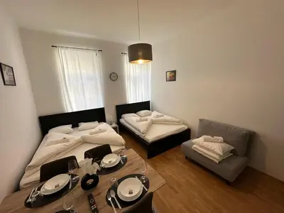 Ein Bett oder Betten in einem Zimmer der Unterkunft Cozy-5-Person apartment in Vienna 5