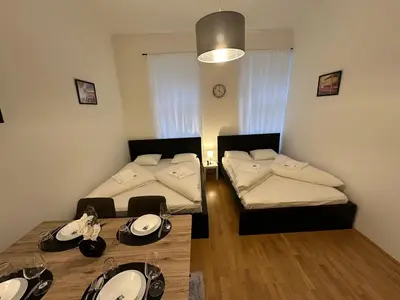 Ein Bett oder Betten in einem Zimmer der Unterkunft Cozy-5-Person apartment in Vienna 5