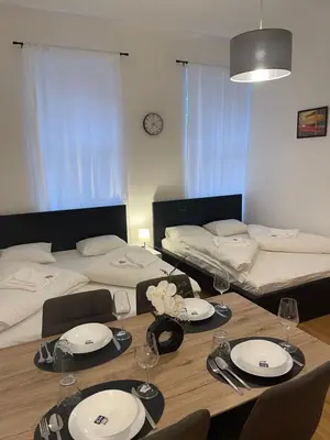 Ein Bett oder Betten in einem Zimmer der Unterkunft Cozy-5-Person apartment in Vienna 5