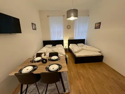Ein Bett oder Betten in einem Zimmer der Unterkunft Cozy-5-Person apartment in Vienna 5