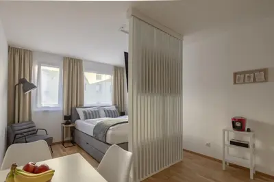 Ein Bett oder Betten in einem Zimmer der Unterkunft EA-Modernes Studio nähe Hauptplatz