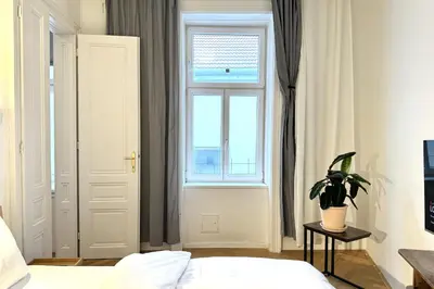 Ein Bett oder Betten in einem Zimmer der Unterkunft Green Prater City Apartment