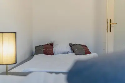 Ein Bett oder Betten in einem Zimmer der Unterkunft Garden-Eden Apartment
