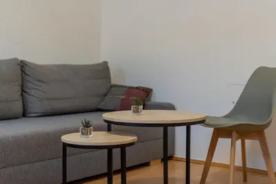 Ein Sitzbereich in der Unterkunft Garden-Eden Apartment