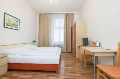 Ein Bett oder Betten in einem Zimmer der Unterkunft Pension Votiv