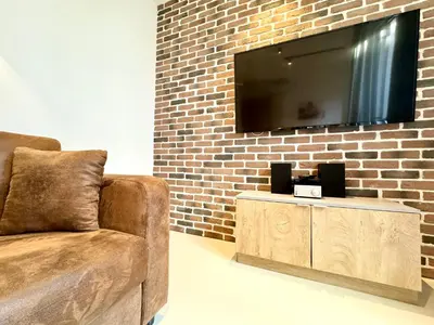 TV/Unterhaltungsangebot in der Unterkunft Möbliertes Apartment mit Terrasse