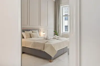 Ein Bett oder Betten in einem Zimmer der Unterkunft Stadtpark City Apartment is Calling - by 4ty3 Apartments