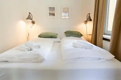 Ein Bett oder Betten in einem Zimmer der Unterkunft Savoir-Vivre in unserer zentralen Balkonwohnung