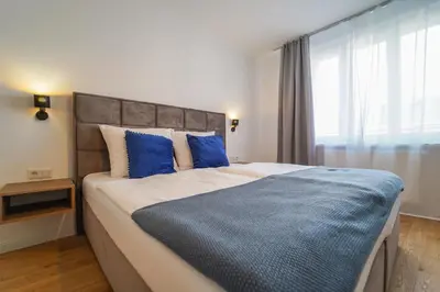 Ein Bett oder Betten in einem Zimmer der Unterkunft BelVie Residence