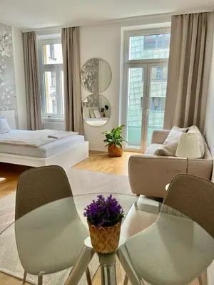 Ein Bett oder Betten in einem Zimmer der Unterkunft Zentrales Apartment mit Balkon