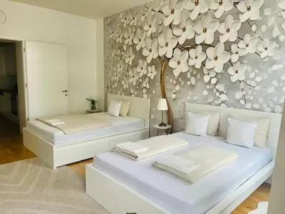 Ein Bett oder Betten in einem Zimmer der Unterkunft Zentrales Apartment mit Balkon