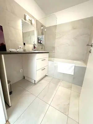 Ein Badezimmer in der Unterkunft COHO City Apartments
