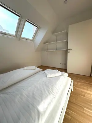 Ein Bett oder Betten in einem Zimmer der Unterkunft COHO City Apartments