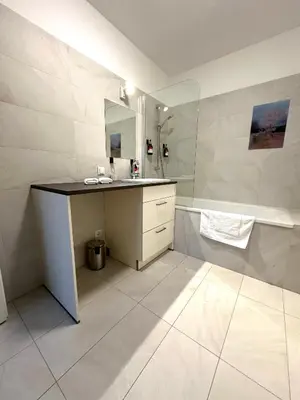 Ein Badezimmer in der Unterkunft COHO City Apartments