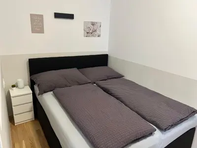 Ein Bett oder Betten in einem Zimmer der Unterkunft Paky Appartements 00209