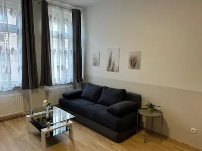 Ein Sitzbereich in der Unterkunft Paky Appartements 00209