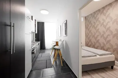 Ein Bett oder Betten in einem Zimmer der Unterkunft Ruhige Apartments nähe U2 Messe Prater