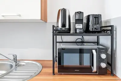 Küche/Küchenzeile in der Unterkunft Bernhards Apartment Flurschützstraße