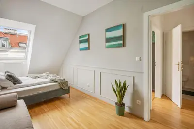 Ein Bett oder Betten in einem Zimmer der Unterkunft Luxury Loft View - 4BR - Gym - Parking - near Centre - Schönbrun