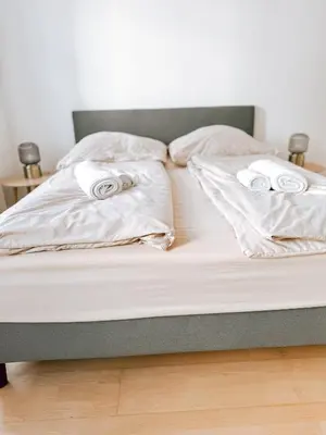 Ein Bett oder Betten in einem Zimmer der Unterkunft Zentrales Apartment nähe Schönbrunn - 5 Pers