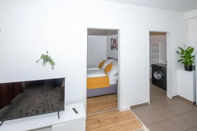 Ein Bett oder Betten in einem Zimmer der Unterkunft Lipi Apartment