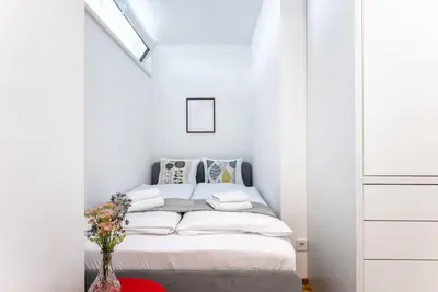 Ein Bett oder Betten in einem Zimmer der Unterkunft Cozy Studio 5min to Center by HM