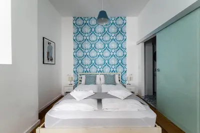 Ein Bett oder Betten in einem Zimmer der Unterkunft Chic Studio Near Metro & Center by HM