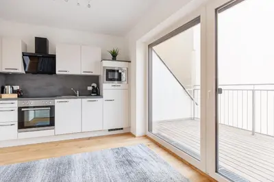 Küche/Küchenzeile in der Unterkunft SYMPHONY Apartments 42 - Modern Loft with Terrace and Grill in Central Location