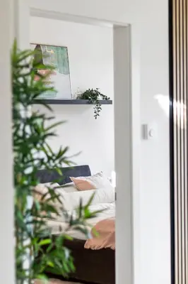 Ein Bett oder Betten in einem Zimmer der Unterkunft FeelHome-Balkon-Zentrum-6 Gäste-WiFi-Smart TV