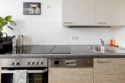 Küche/Küchenzeile in der Unterkunft Helles gemütliches Apartment V5
