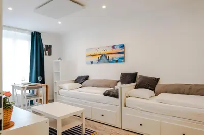 Ein Bett oder Betten in einem Zimmer der Unterkunft Modernes Studio im Zentrum 4 Personen