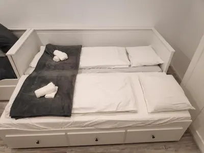 Ein Bett oder Betten in einem Zimmer der Unterkunft Modernes Studio im Zentrum 4 Personen