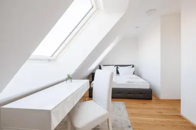 Ein Bett oder Betten in einem Zimmer der Unterkunft SYMPHONY Apartments 39 - Modern Loft with Terrace and Grill in Central Location