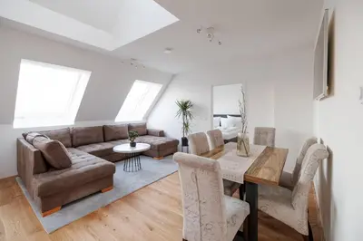 Ein Sitzbereich in der Unterkunft SYMPHONY Apartments 39 - Modern Loft with Terrace and Grill in Central Location