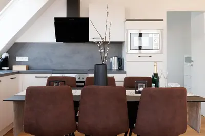 Küche/Küchenzeile in der Unterkunft SYMPHONY Apartments 40 - Modern Loft with Terrace and Grill in Central Location