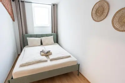 Ein Bett oder Betten in einem Zimmer der Unterkunft Central Living Apartments - Wielemansgasse