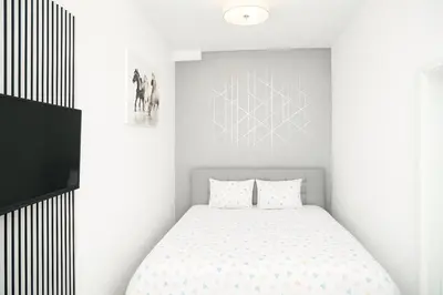 Ein Bett oder Betten in einem Zimmer der Unterkunft City Flat D