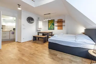 Ein Bett oder Betten in einem Zimmer der Unterkunft Penthouse Suites by JR City Apartments