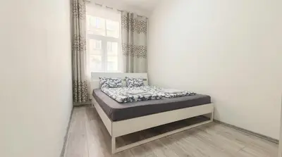 Ein Bett oder Betten in einem Zimmer der Unterkunft 15 Min to Vienna Center - Affordable & Simple 5BR Apt with WIFI