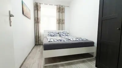 Ein Bett oder Betten in einem Zimmer der Unterkunft 15 Min to Vienna Center - Affordable & Simple 5BR Apt with WIFI