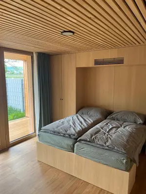 Ein Bett oder Betten in einem Zimmer der Unterkunft Tiny House Brunn am Gebirge
