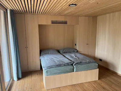 Ein Bett oder Betten in einem Zimmer der Unterkunft Tiny House Brunn am Gebirge