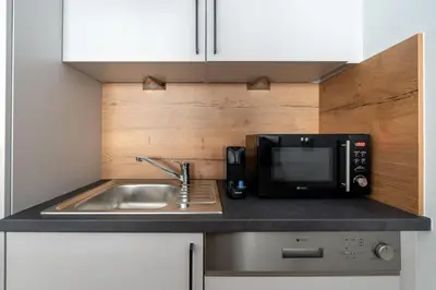 Küche/Küchenzeile in der Unterkunft Urban 1BR Retreat, Easy City Link by HM