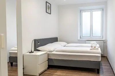 Ein Bett oder Betten in einem Zimmer der Unterkunft CENTRAL HUB close to main station by JR City Apartments