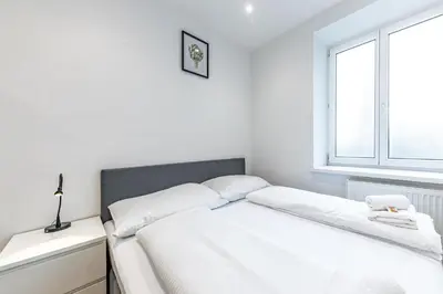 Ein Bett oder Betten in einem Zimmer der Unterkunft CENTRAL HUB close to main station by JR City Apartments