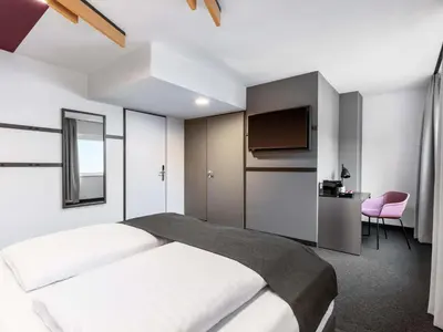 Ein Bett oder Betten in einem Zimmer der Unterkunft B&B HOTEL Wien-St-Marx