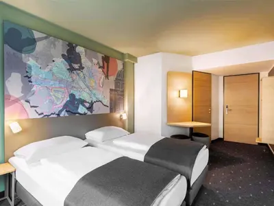 Ein Bett oder Betten in einem Zimmer der Unterkunft B&B HOTEL Wien-St-Marx