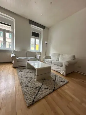 Ein Sitzbereich in der Unterkunft Stadthalle charmante Wohnung
